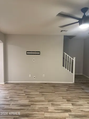 a view of a room with wooden floor