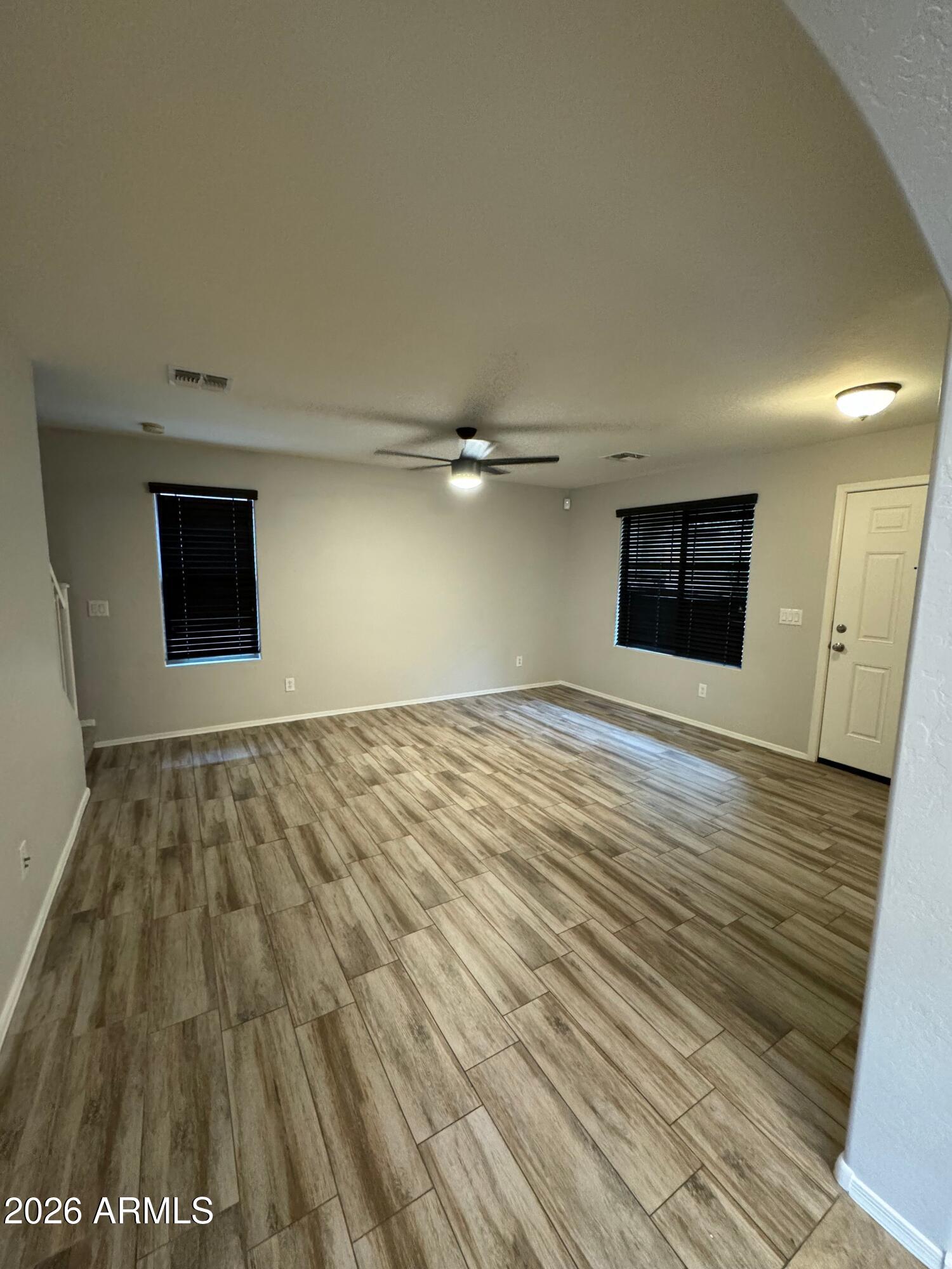 2491 East Boston Street Gilbert, AZ 85295 - Photo 18 of 22 wooden floor in an empty room with a window