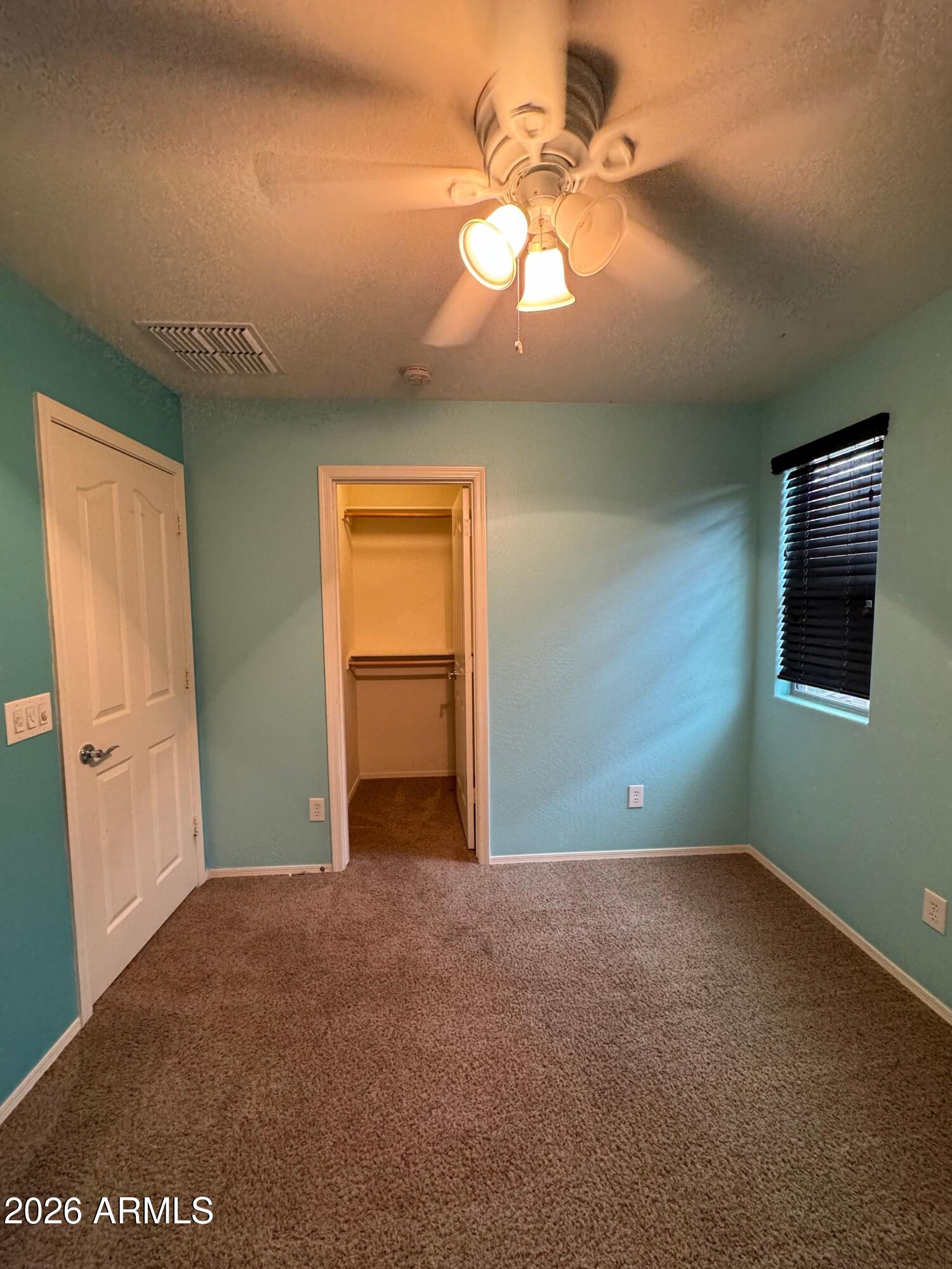 2491 East Boston Street Gilbert, AZ 85295 - Photo 5 of 22 a view of an empty room with a window