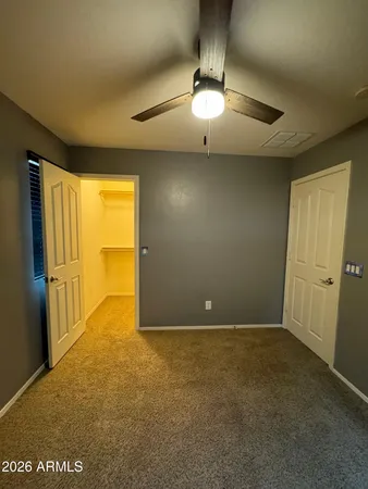 an empty room with a empty space and windows
