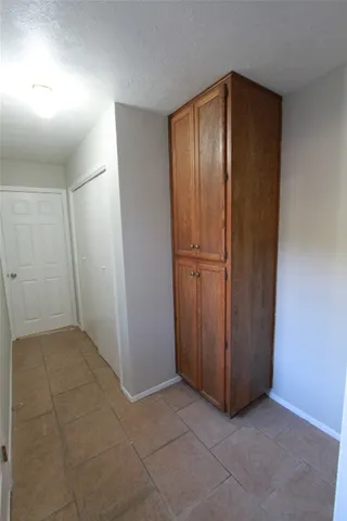 an empty room with closet area