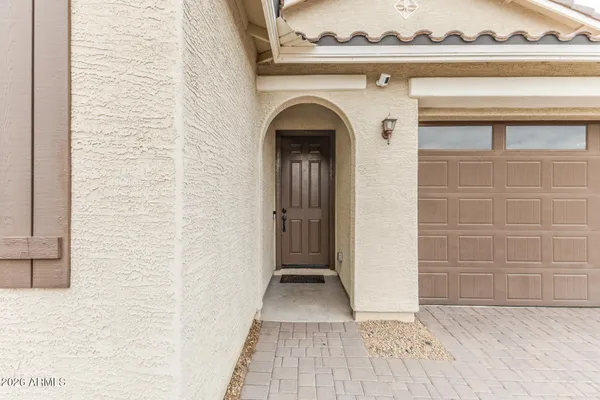 a view of a livingroom with wooden floor and a window