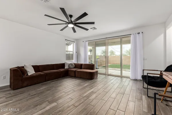 a living room with furniture and a large window