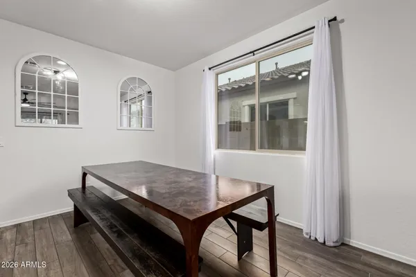 a view of a dining room with furniture and window