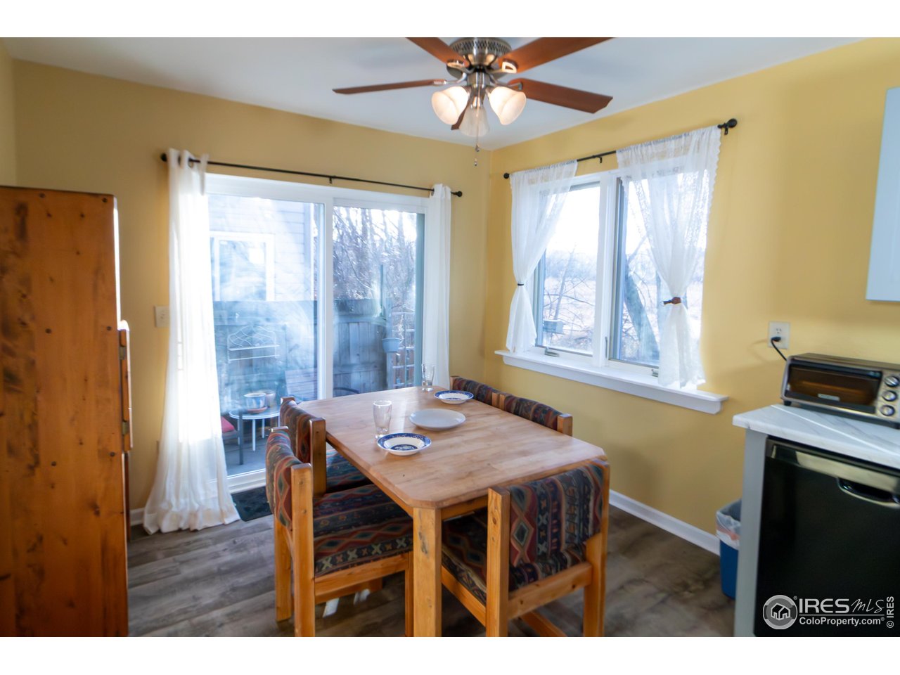 4651 Portside Way Boulder, CO 80301 - Photo 8 of 19 a view of a dining room with furniture window and outside view