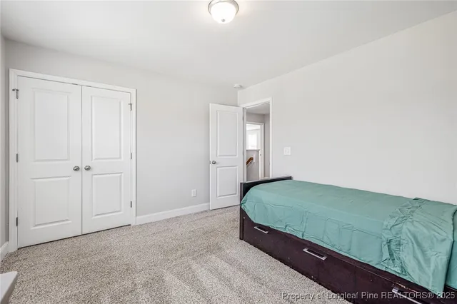 a living room with a couch and dresser