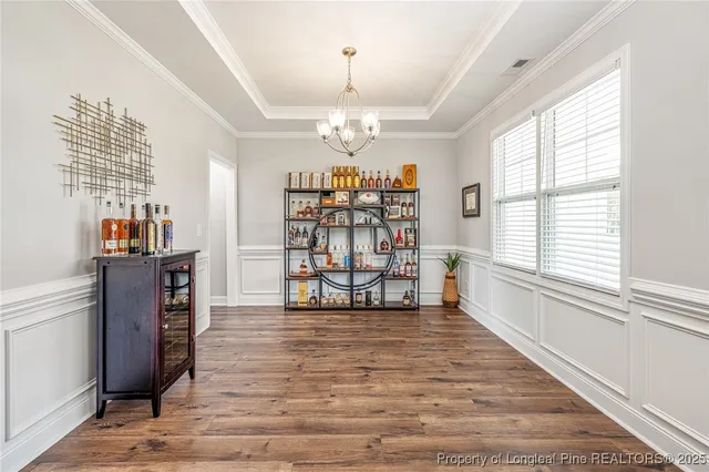a view of a windows and chandelier in a room