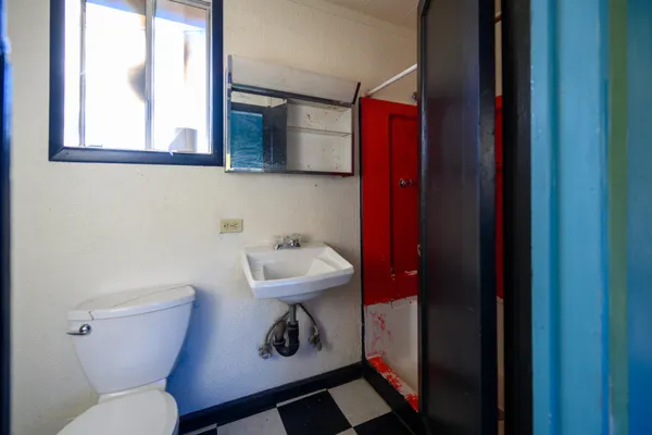 a bathroom with a toilet and a sink
