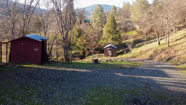 a view of a house with a yard