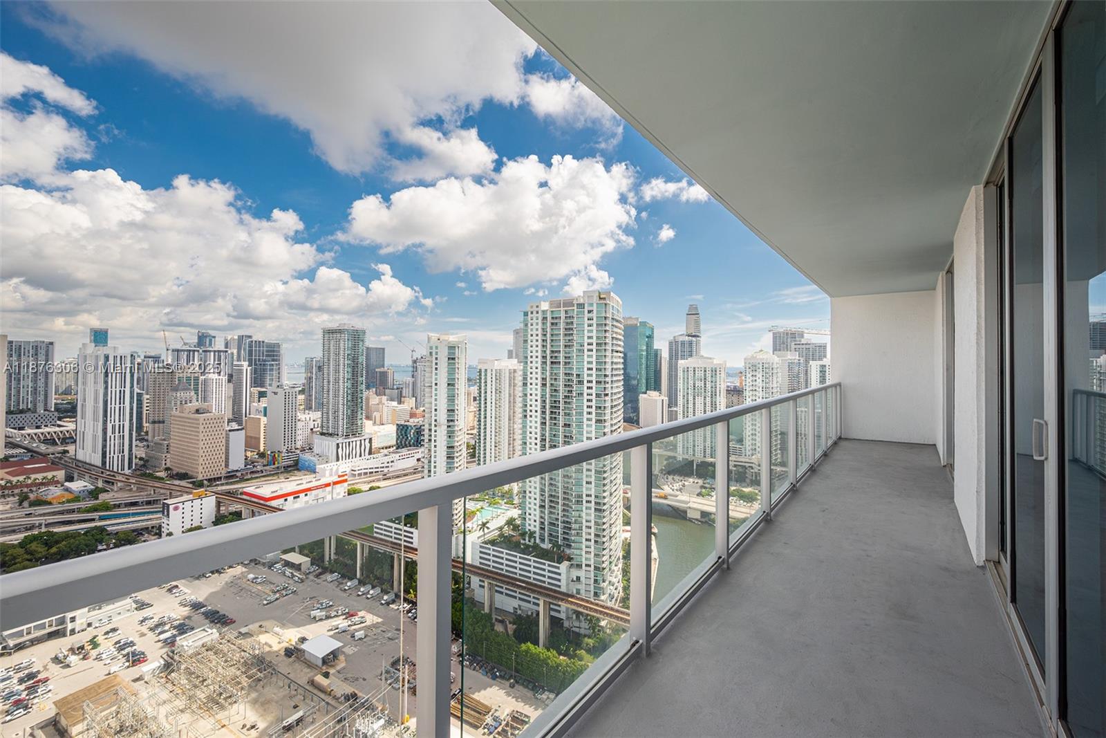 185 Southwest 7th Street, Unit 4201 Miami, FL 33130 - Photo 13 of 29 a view of a balcony with wooden floor