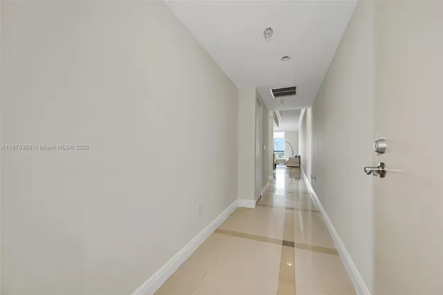 a view of a hallway with a white walls