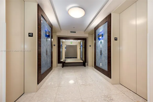 a view of a hallway with wooden shelves