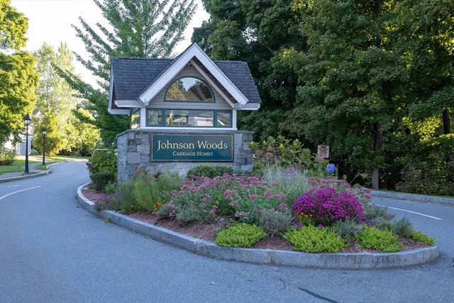 a front view of a house with a yard and fountain