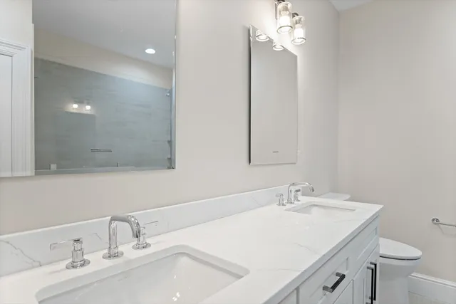 a bathroom with a sink vanity and a mirror