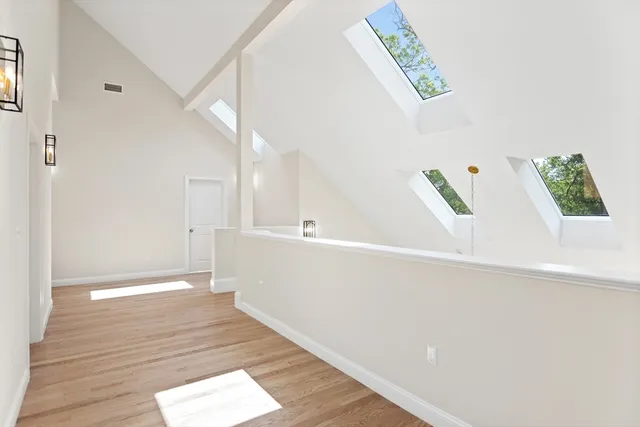 a view of an entryway with wooden floor