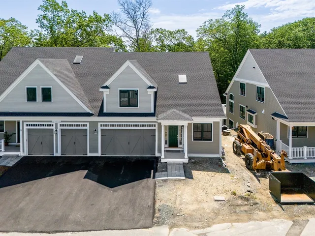 a aerial view of a house with a yard