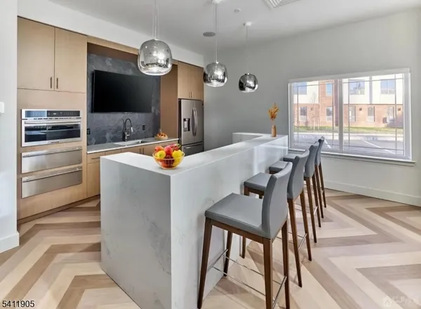 a very nice looking dining room with a large screen tv