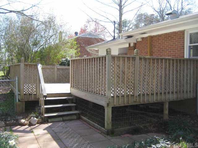 5113 Old Stage Road Raleigh, NC 27603 - Photo 11 of 12 a view of outdoor space with deck and garden