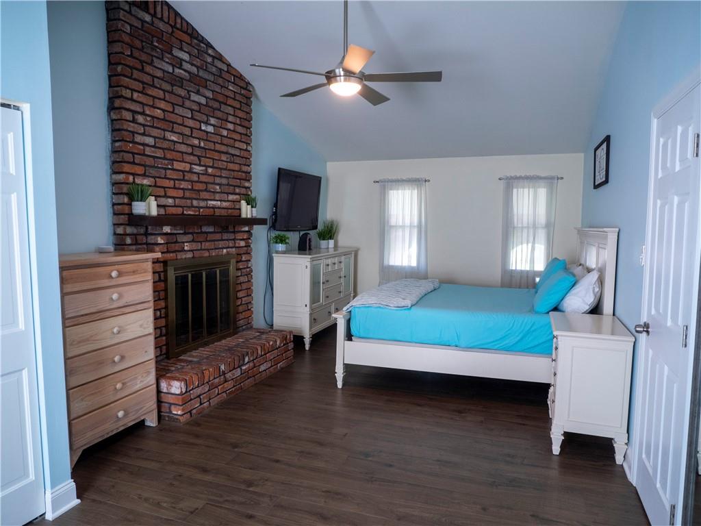 102 Bertley Ridge Drive Coraopolis, PA 15108 - Photo 11 of 25 a bedroom with a bed and a flat tv screen on dresser