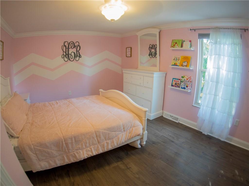 102 Bertley Ridge Drive Coraopolis, PA 15108 - Photo 15 of 25 a bedroom with a bed and painting on the wall