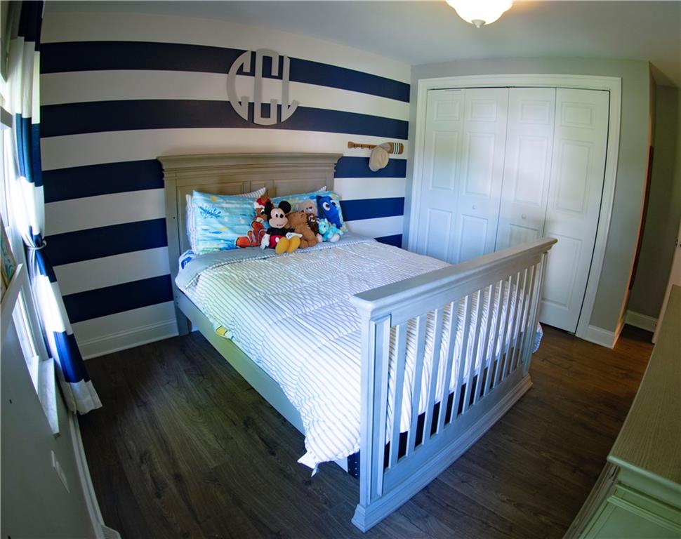 102 Bertley Ridge Drive Coraopolis, PA 15108 - Photo 17 of 25 a bedroom with a bed and wooden floor