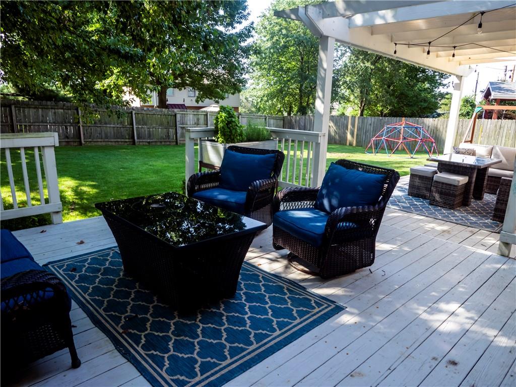 102 Bertley Ridge Drive Coraopolis, PA 15108 - Photo 22 of 25 a view of a patio with couches chairs dining table and chairs barbeque grill with a small yard