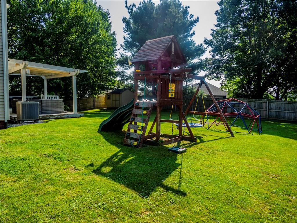 102 Bertley Ridge Drive Coraopolis, PA 15108 - Photo 25 of 25 a view of a backyard with table and chairs and a slide