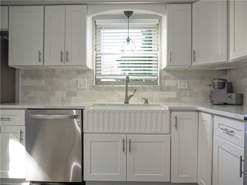 102 Bertley Ridge Drive Coraopolis, PA 15108 - Photo 5 of 25 a kitchen with white cabinets and window