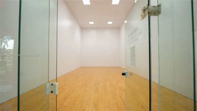 a room with gym equipment and a large window