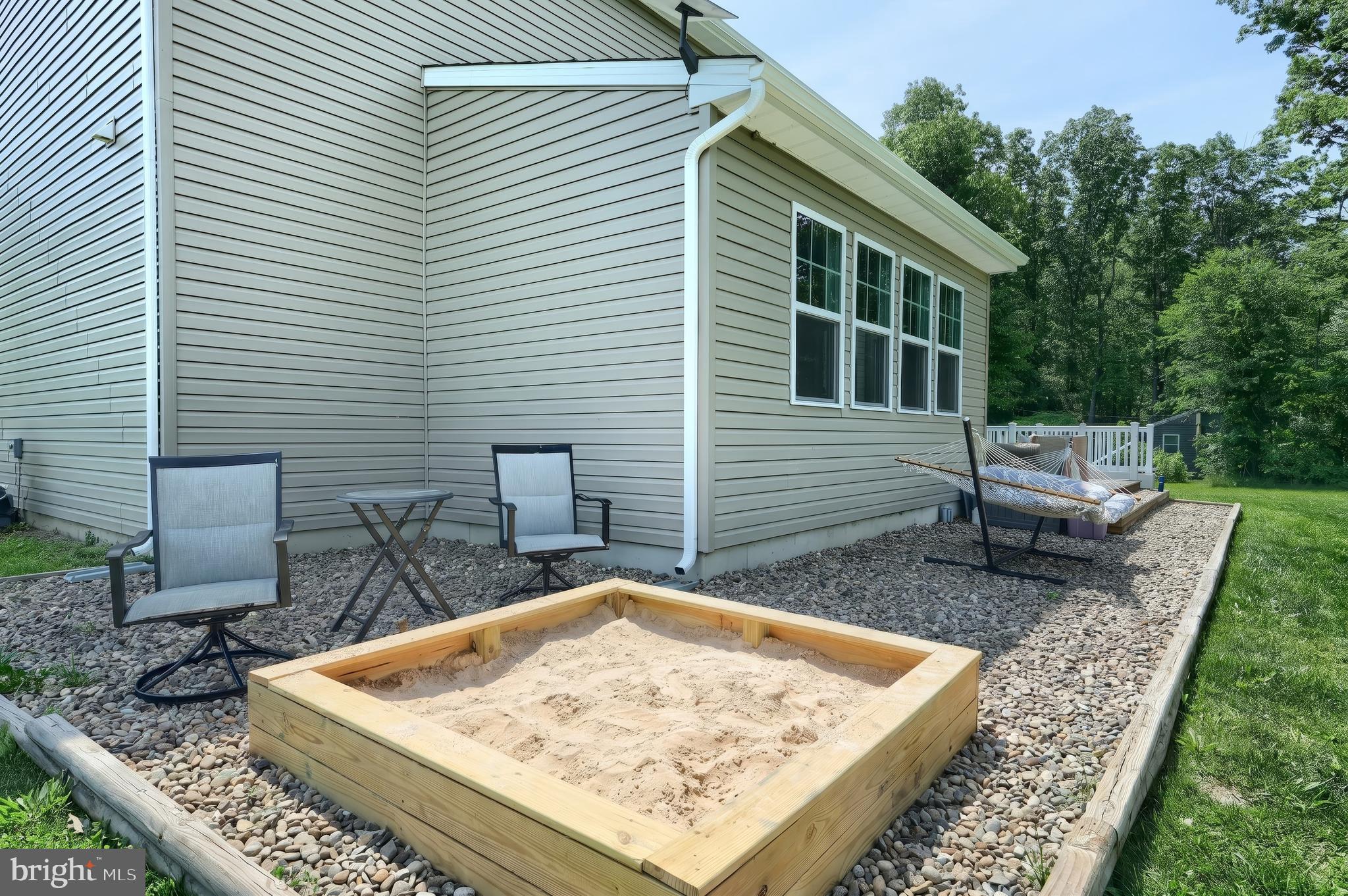 2741 Cold Springs Road Orrtanna, PA 17353 - Photo 12 of 52 a view of a backyard with chairs and a patio