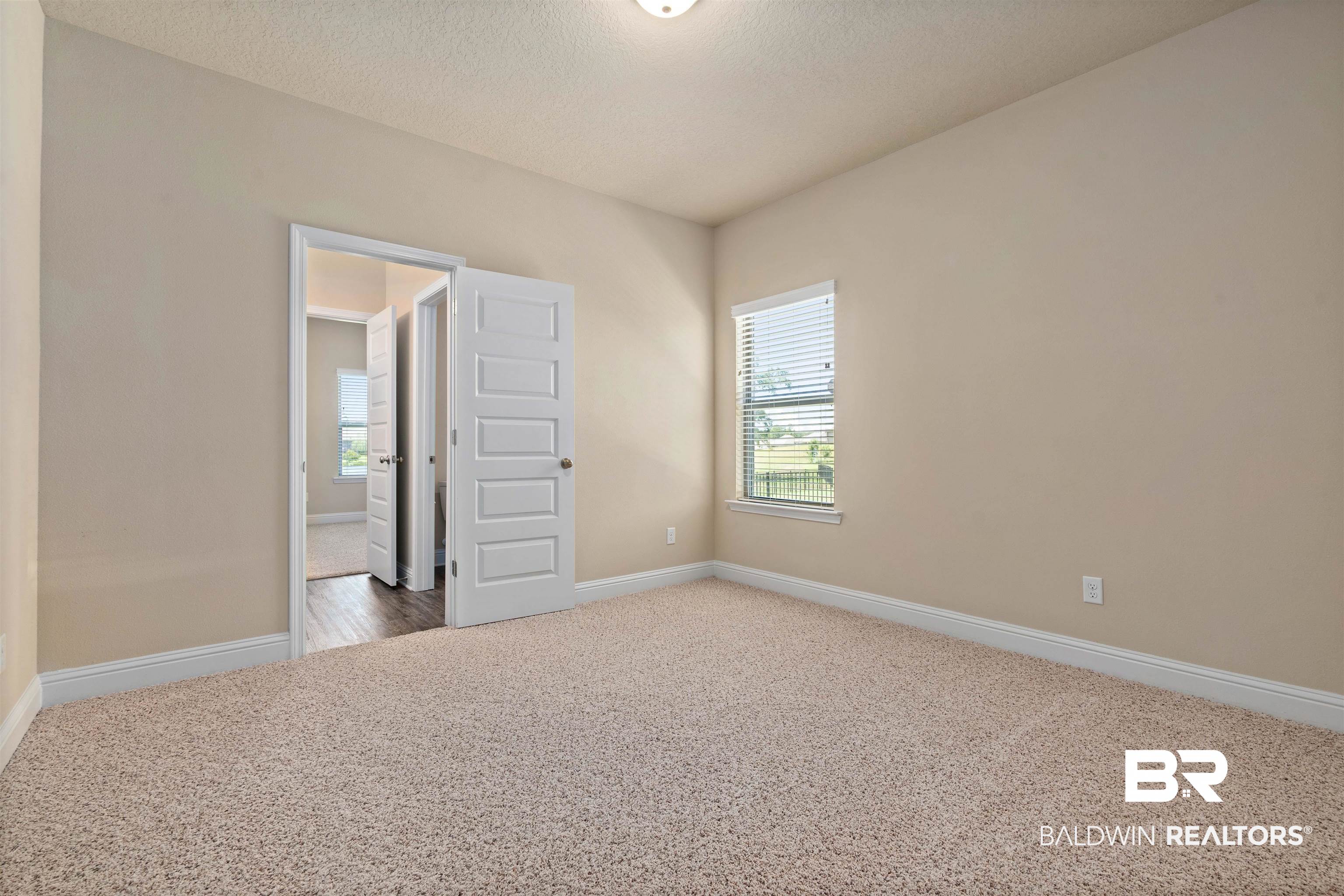 1864 Gwin Court Mobile, AL 36695 - Photo 25 of 37 Carpeted empty room with a textured ceiling