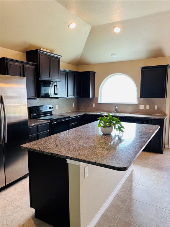7522 Ranch View Drive Corpus Christi, TX 78414 - Photo 2 of 17 a kitchen with kitchen island granite countertop a sink and a refrigerator