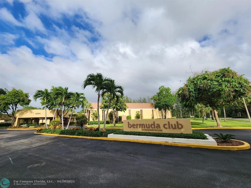 5851 Northwest 62nd Avenue, Unit 105 Tamarac, FL 33319 - Photo 14 of 18 a view of a swimming pool and trees in the background
