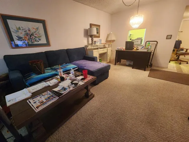 a living room with furniture and a couch