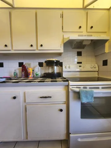 a kitchen with stainless steel appliances granite countertop a sink and cabinets