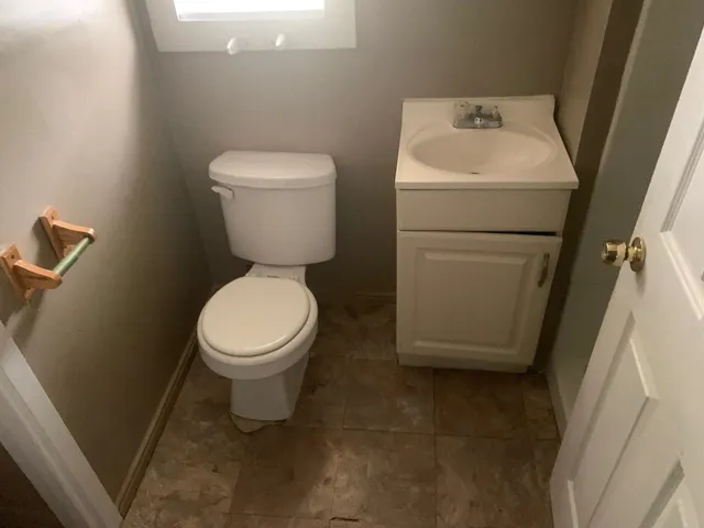 a bathroom with a toilet and a sink