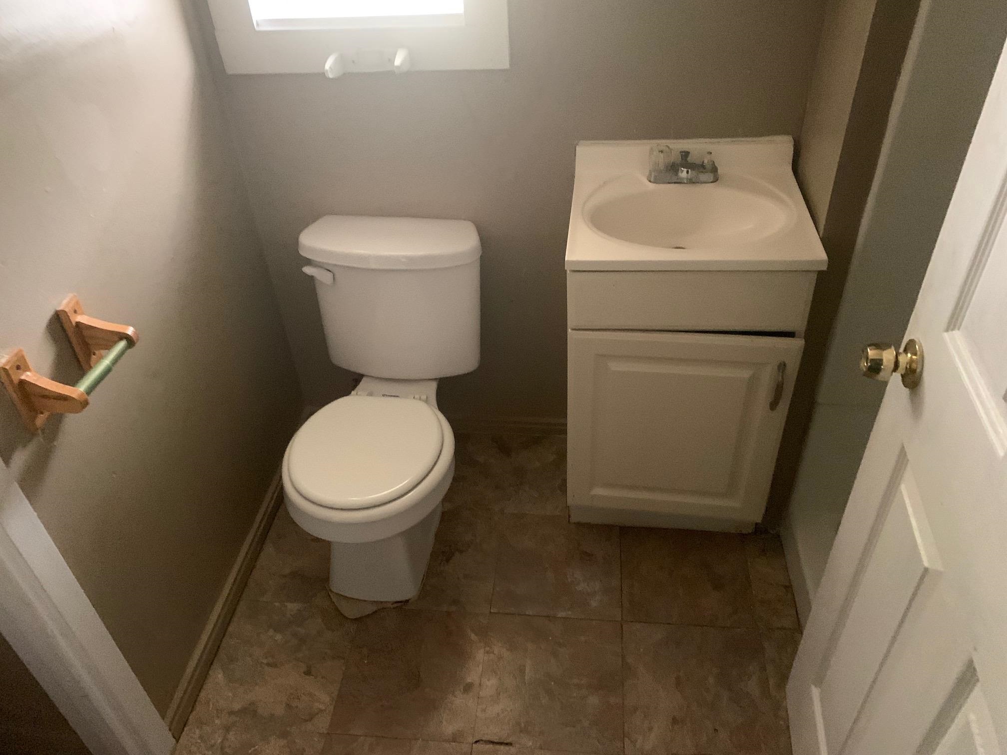 3054 Coleman Avenue Memphis, TN 38112 - Photo 3 of 11 a bathroom with a toilet and a sink