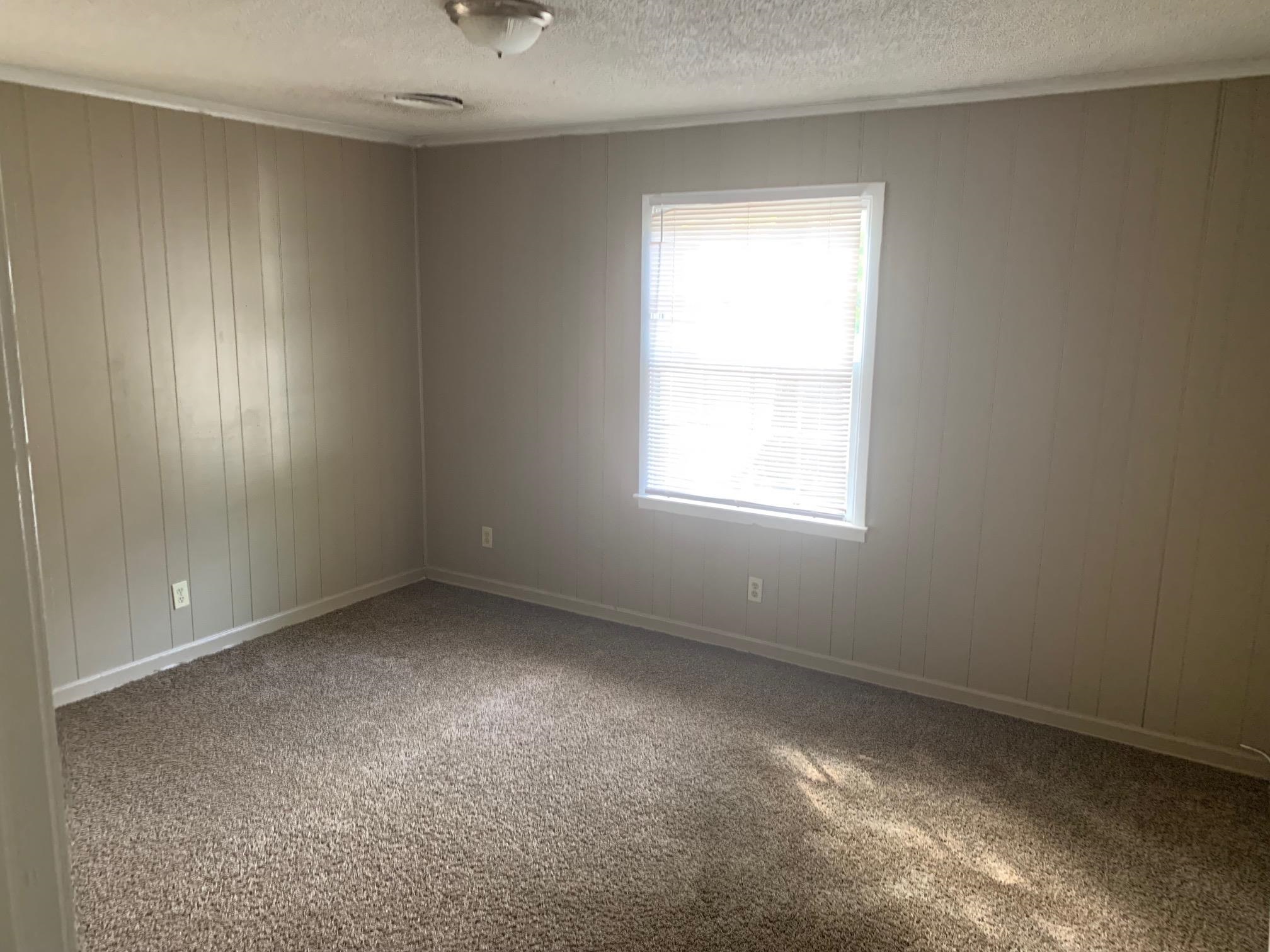 3054 Coleman Avenue Memphis, TN 38112 - Photo 5 of 11 an empty room with a window