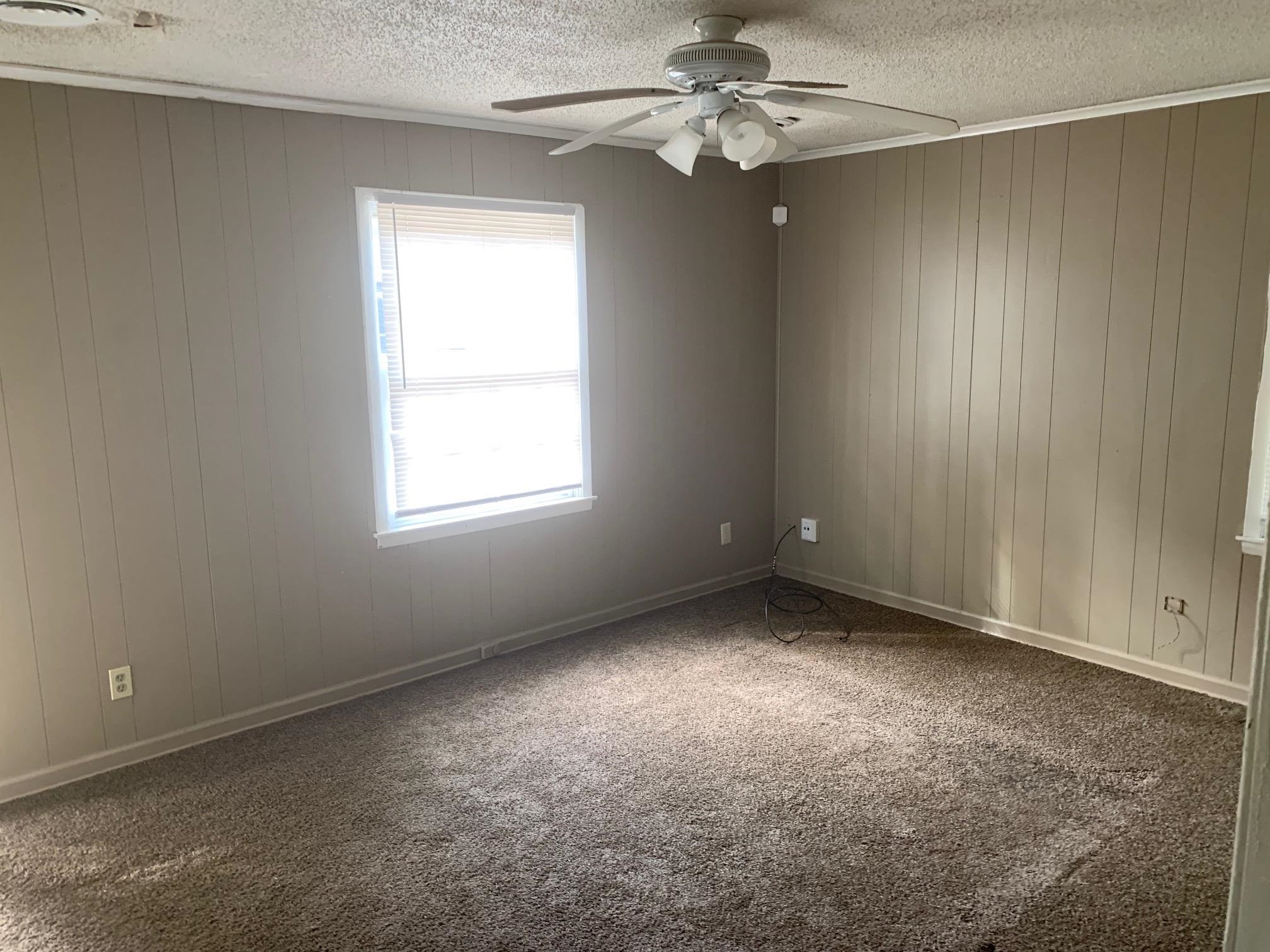 3054 Coleman Avenue Memphis, TN 38112 - Photo 6 of 11 an empty room with a window and a fan