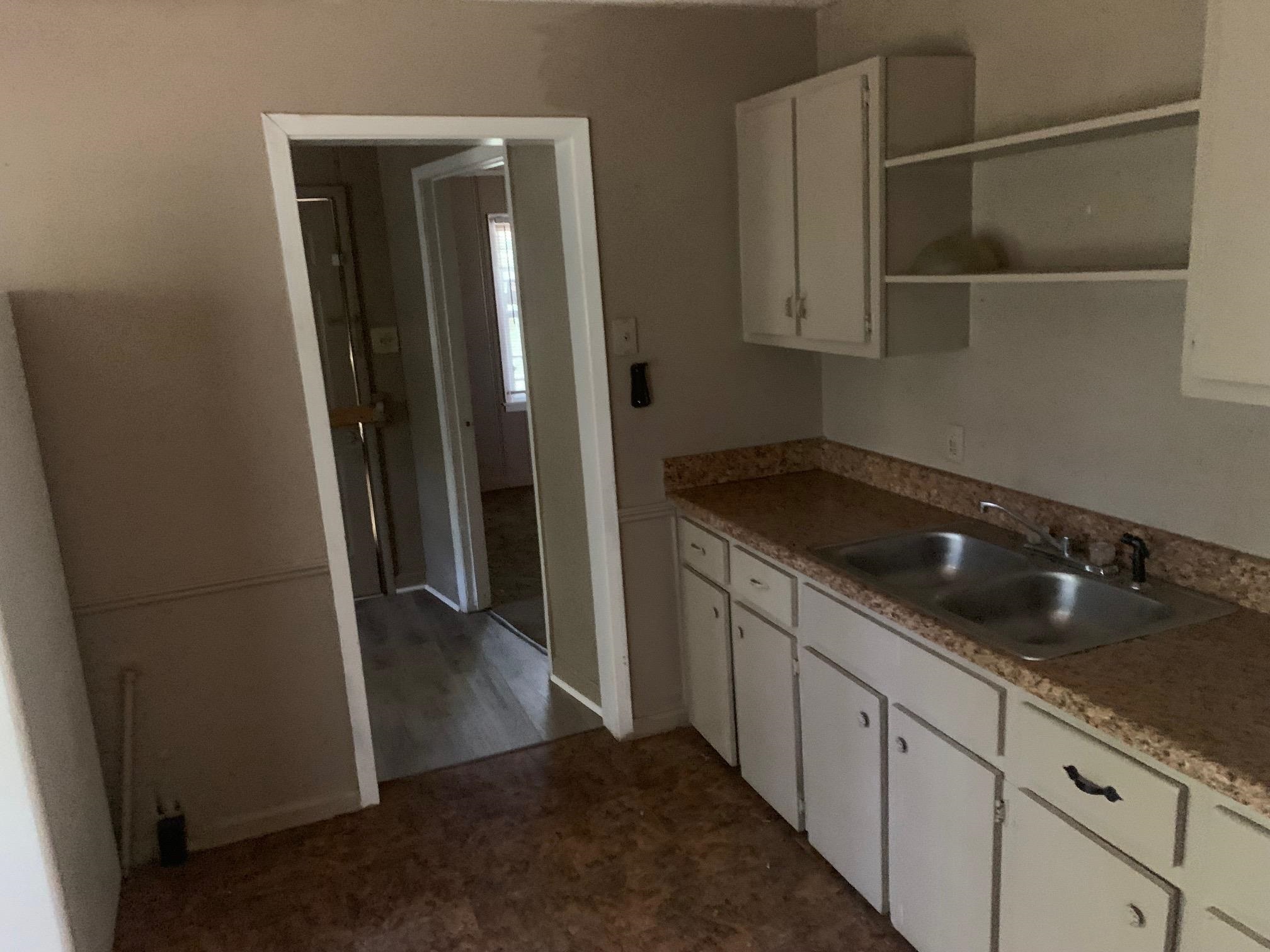 3054 Coleman Avenue Memphis, TN 38112 - Photo 9 of 11 a kitchen with a sink and cabinets