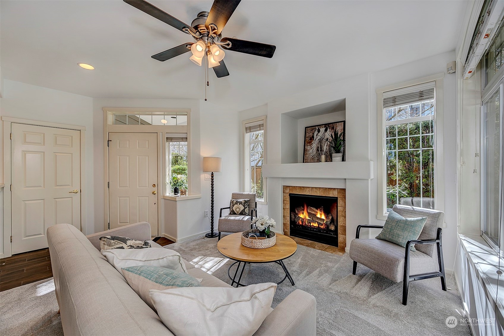 a living room with furniture and a fireplace