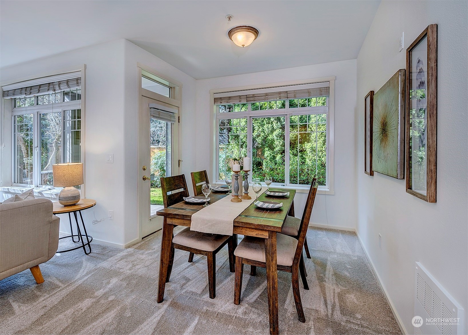 555 Anacortes Court Northeast, Unit 101 Renton, WA 98059 - Photo 11 of 22 a view of a dining room with furniture window and outside view