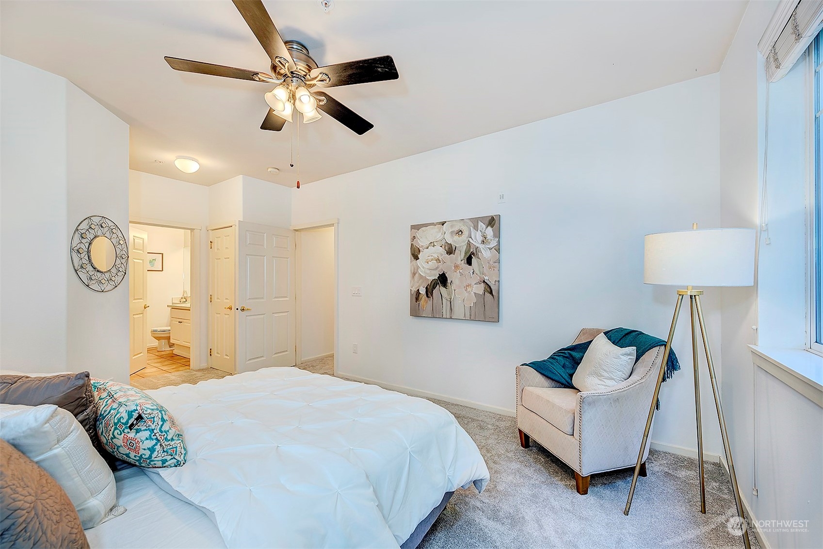 555 Anacortes Court Northeast, Unit 101 Renton, WA 98059 - Photo 15 of 22 a bedroom with bed and a chandelier