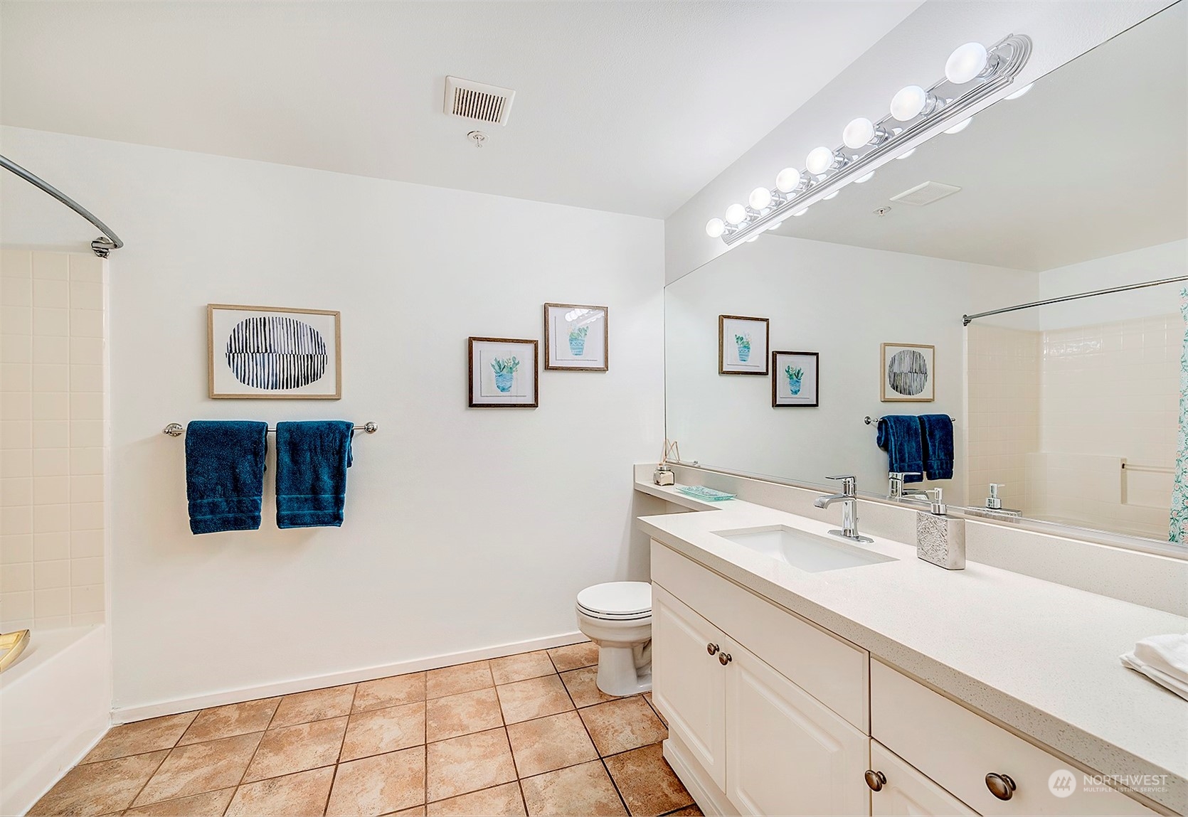 555 Anacortes Court Northeast, Unit 101 Renton, WA 98059 - Photo 16 of 22 a bathroom with a sink a toilet and mirror