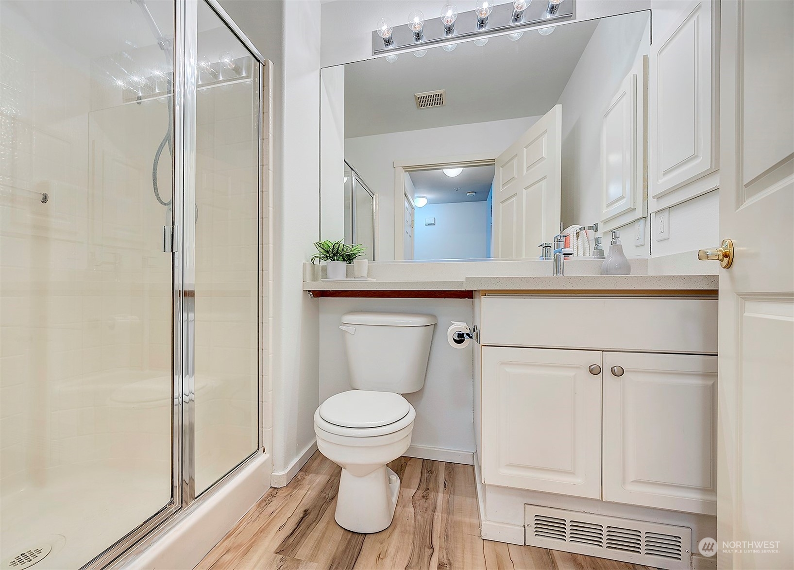 555 Anacortes Court Northeast, Unit 101 Renton, WA 98059 - Photo 18 of 22 a bathroom with a toilet sink and shower