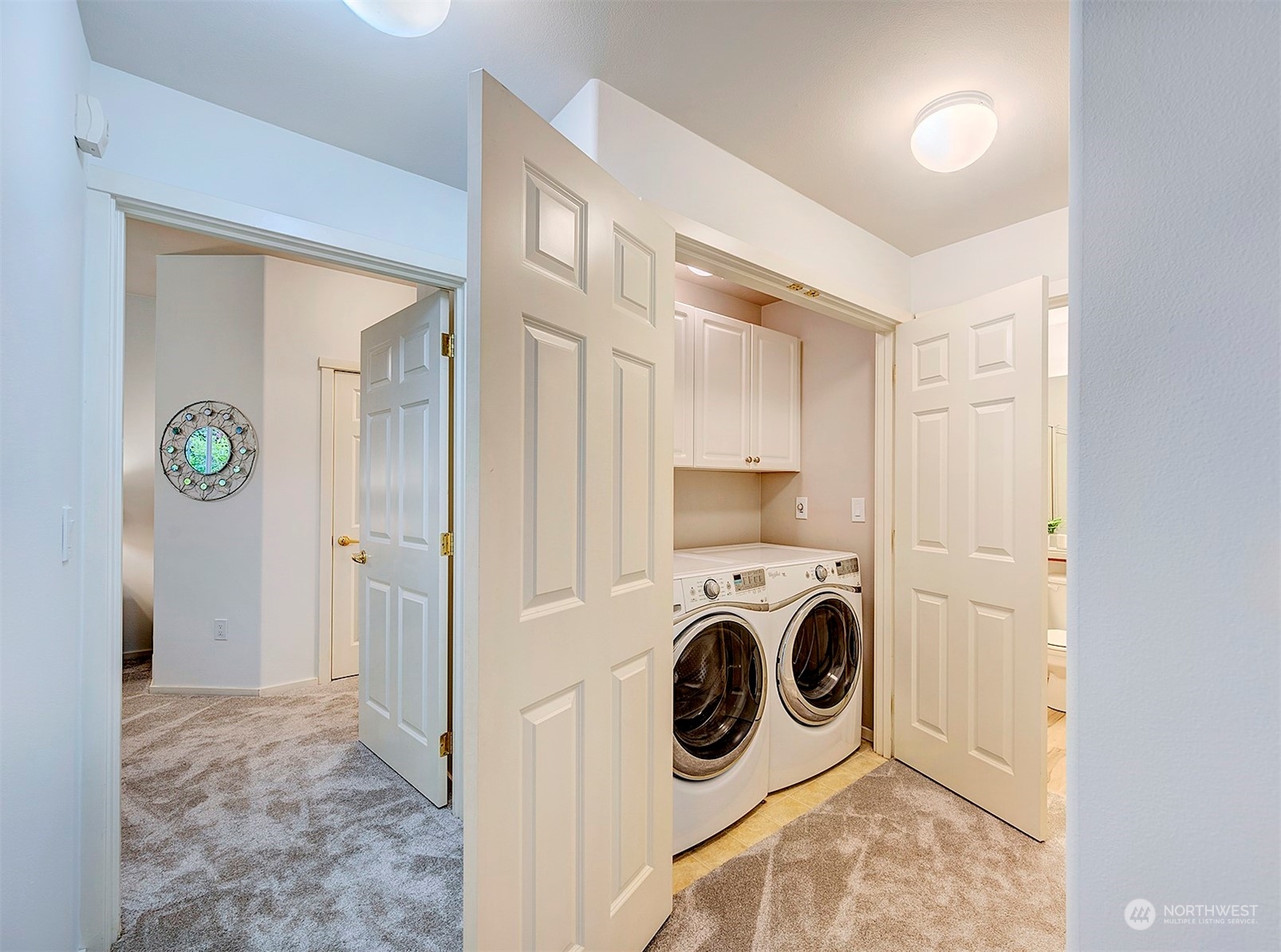 555 Anacortes Court Northeast, Unit 101 Renton, WA 98059 - Photo 19 of 22 a view of a kitchen with washer and dryer