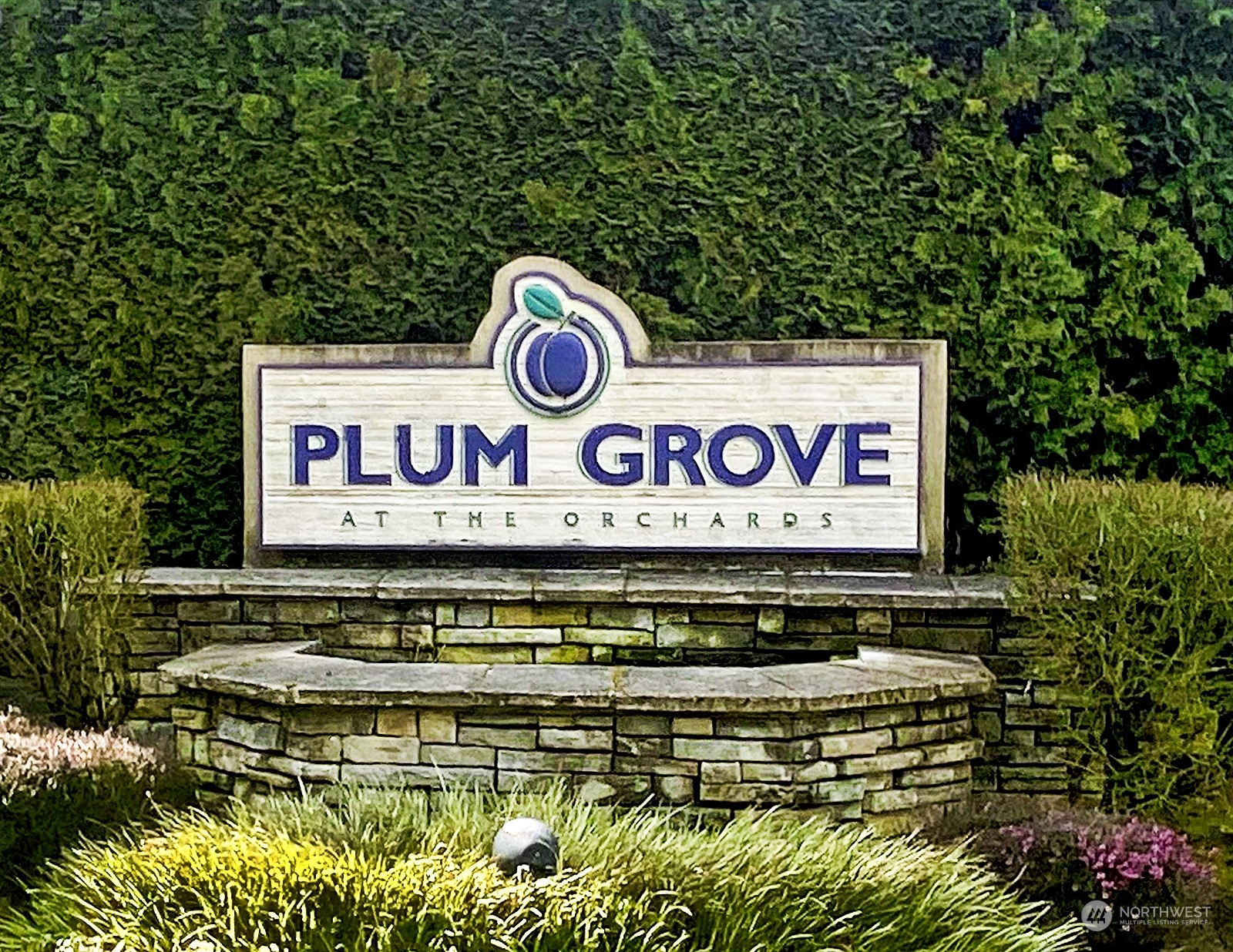 555 Anacortes Court Northeast, Unit 101 Renton, WA 98059 - Photo 21 of 22 a sign broad on a brick wall