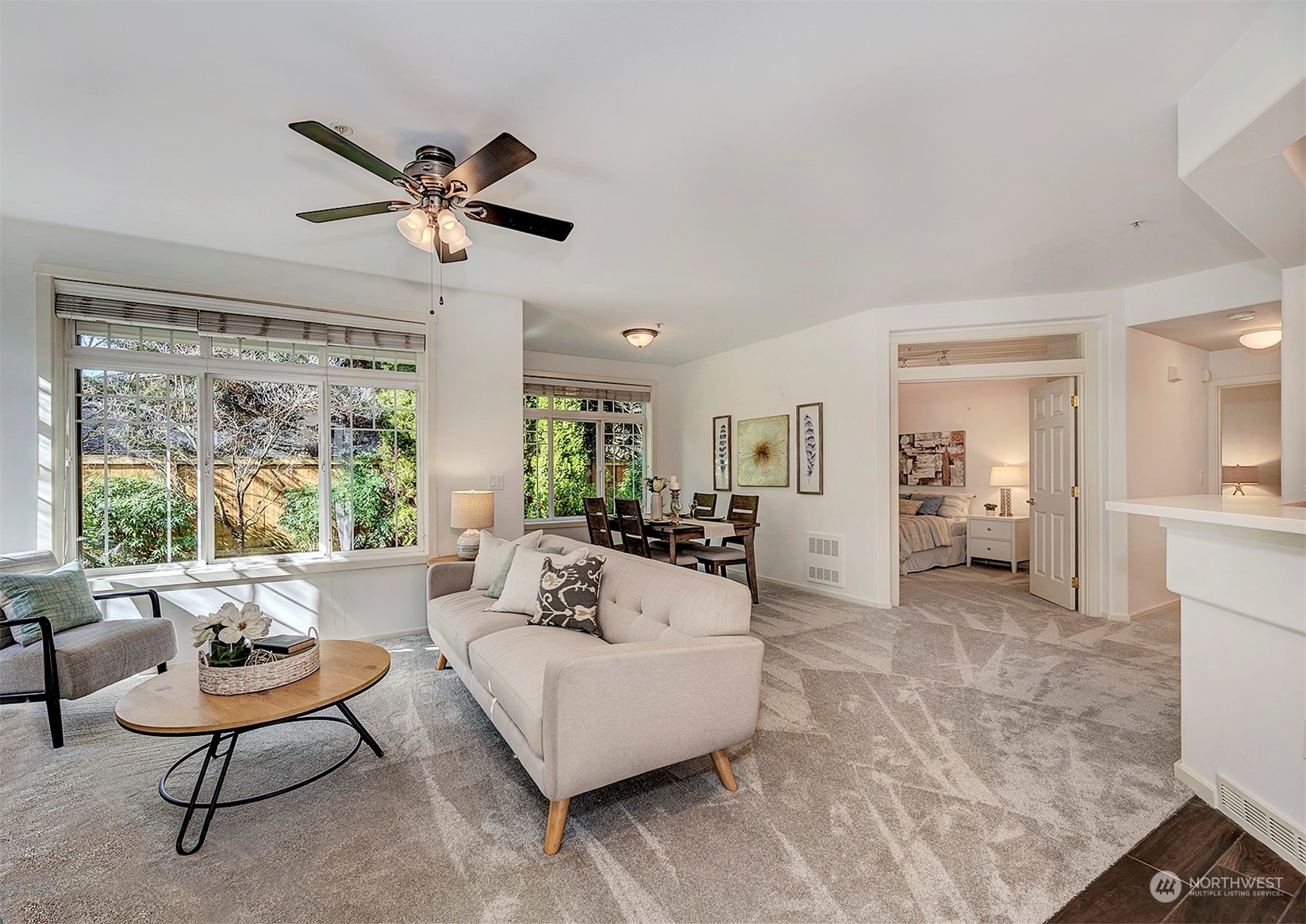 555 Anacortes Court Northeast, Unit 101 Renton, WA 98059 - Photo 5 of 22 a living room with furniture and a large window