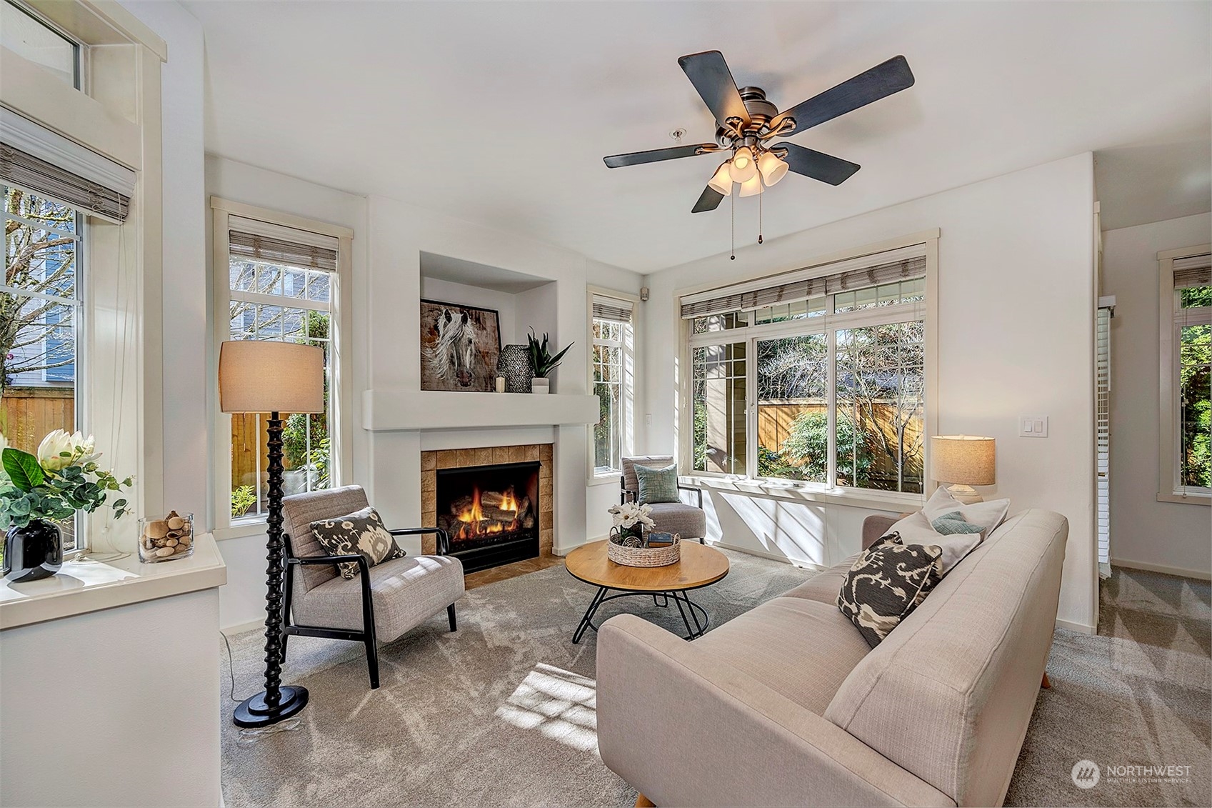 555 Anacortes Court Northeast, Unit 101 Renton, WA 98059 - Photo 6 of 22 a living room with furniture and a fireplace