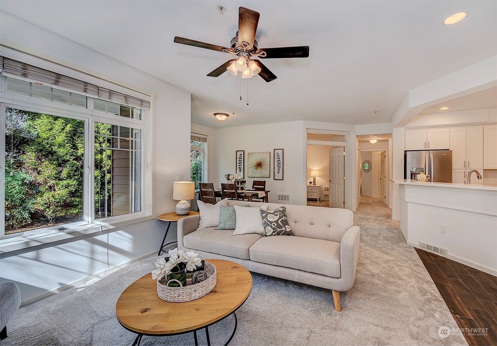 555 Anacortes Court Northeast, Unit 101 Renton, WA 98059 - Photo 7 of 22 a living room with furniture and a large window